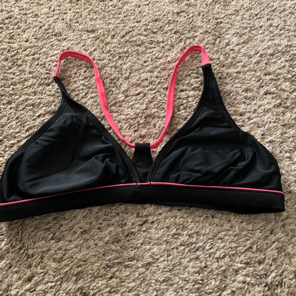 Used black and pink swim top